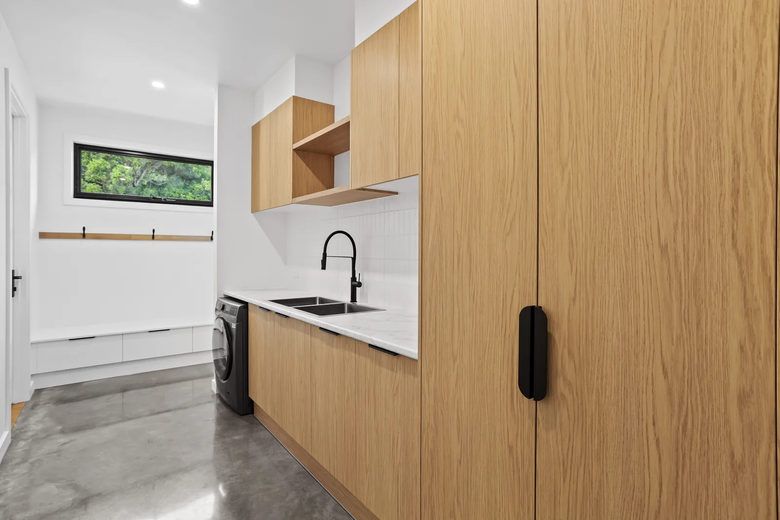 Laundry with oak cabinetry, Mirboo North